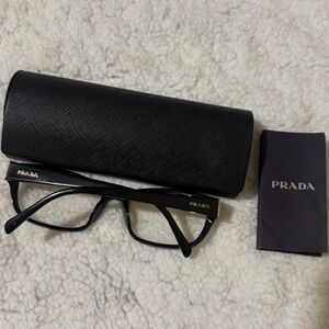 Prada Black Designer Eyeglasses with Case 
Frame is a classic